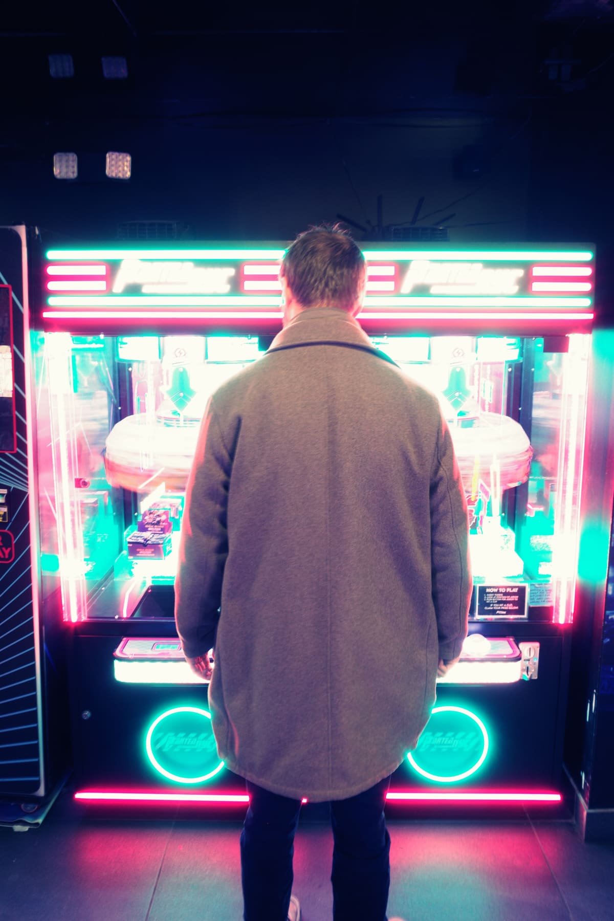 Man in front of an arcade machine